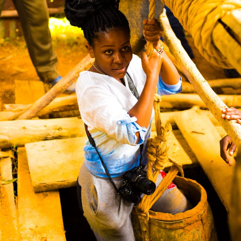 Gender Dynamics in Mining: Why Women don’t go into mines. Young lady holds rope while entering a gold mine in Western Kenya