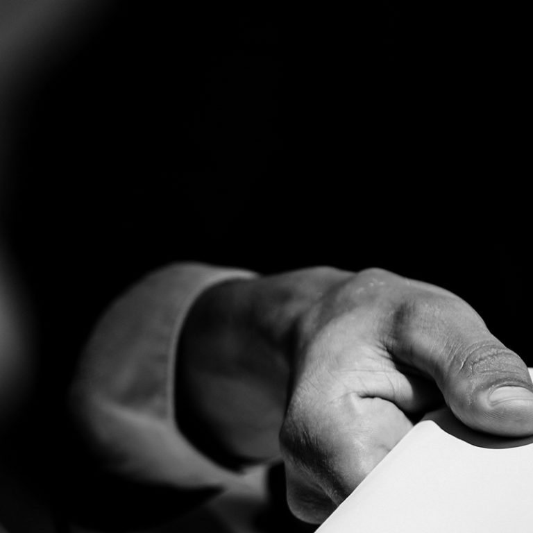 Picture of a businessman’s hand holding money to give a bribe Picture of a businessman's hand holding money to give a bribe