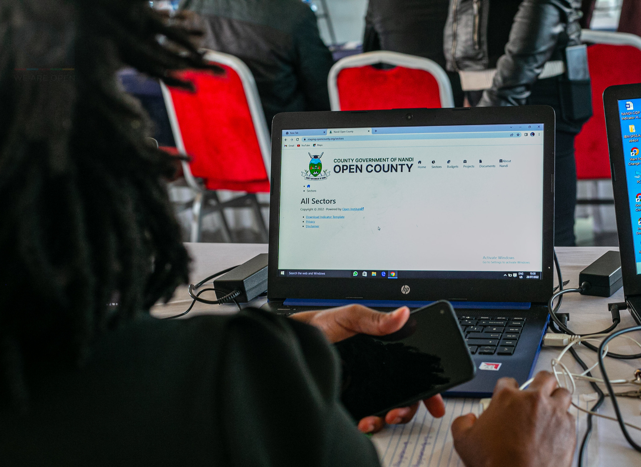 Member of Nandi statistics team looks at a screen displaying the Data Desk back-end